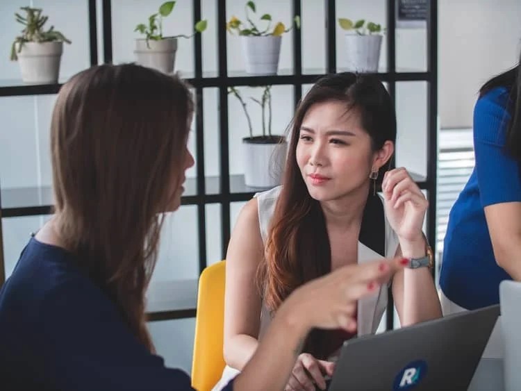 two women in a conversation making eye contact