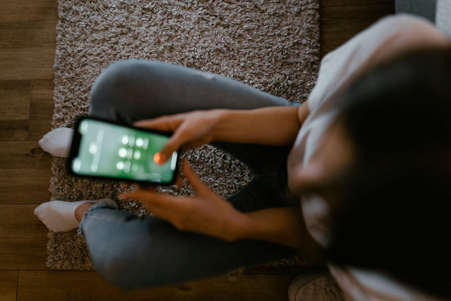 a person using a mobile phone and looking at it