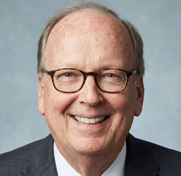 a person holding a cell phone with an amg entertainment app on the screen