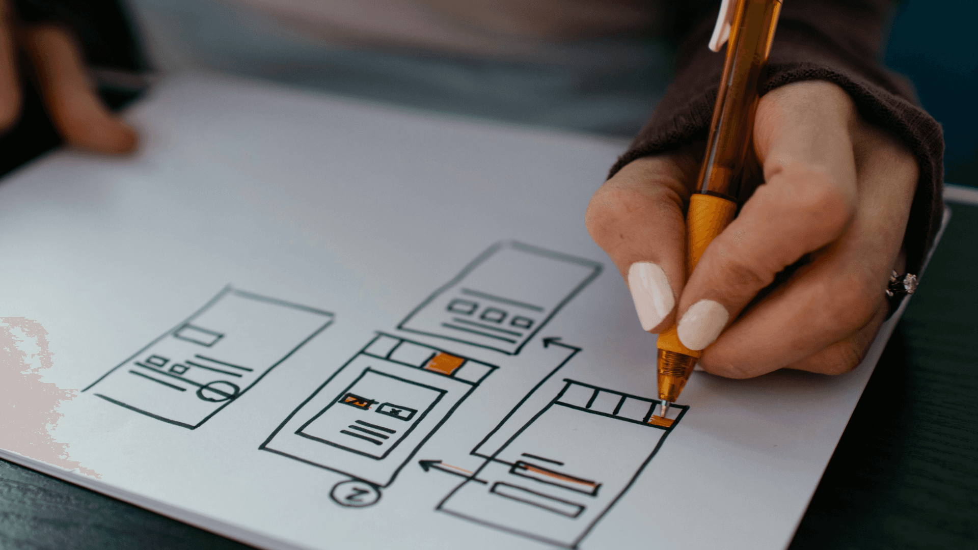 yellow click pen on white printer paper