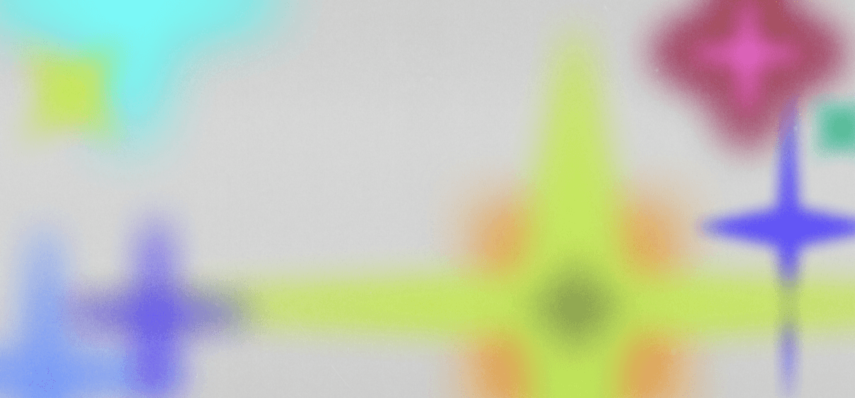 Two young children stand facing a large glass window covered in colorful drawings, doodles, and handwritten notes in yellow and blue marker. One child points at the glass while the other looks on.