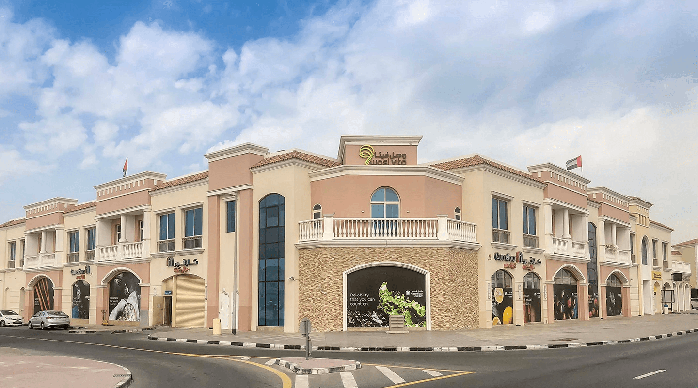 Wasl Vita in the Al Wasl area with numerous cars parked in front of it.