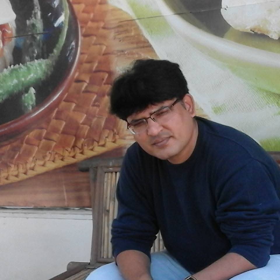 A cartoon character wearing a blue shirt and a blue hat