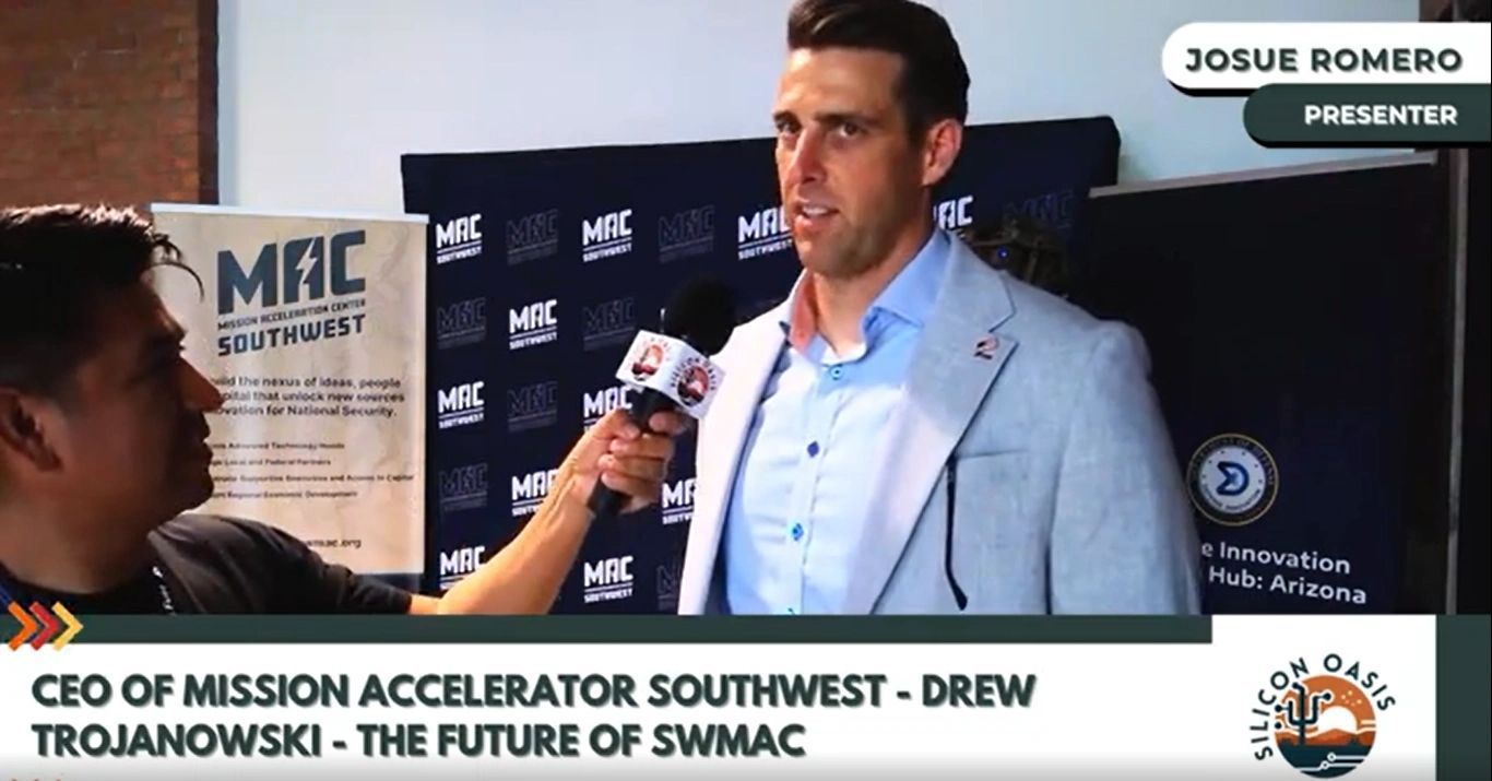 a black and white living room with a large tv