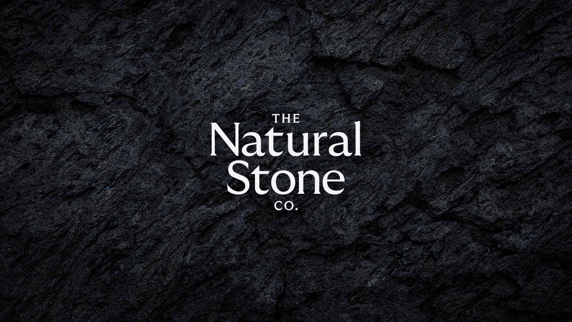 Natural Stone Company logo on deep stone background