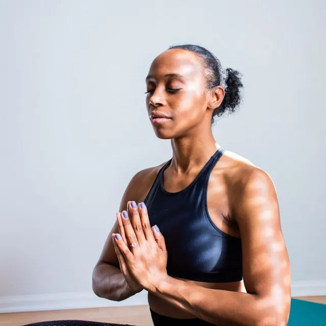 Woman meditating with her eyes closed