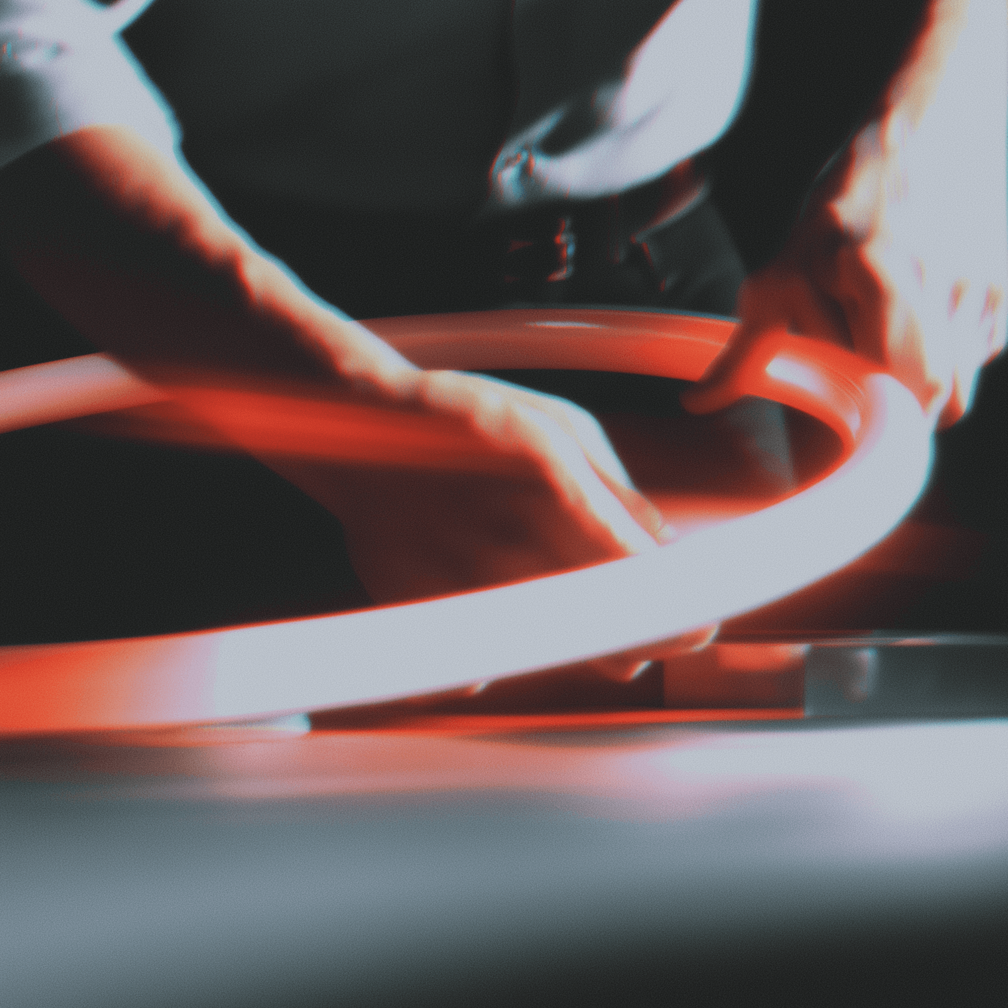 Hands Bending a Led Banner