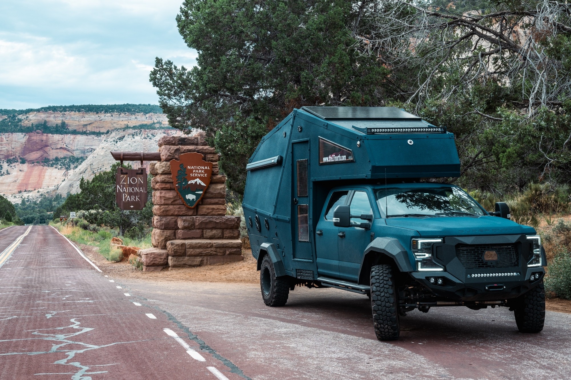 27North adventure vehicle in front of Zion National Park Entrance Gate