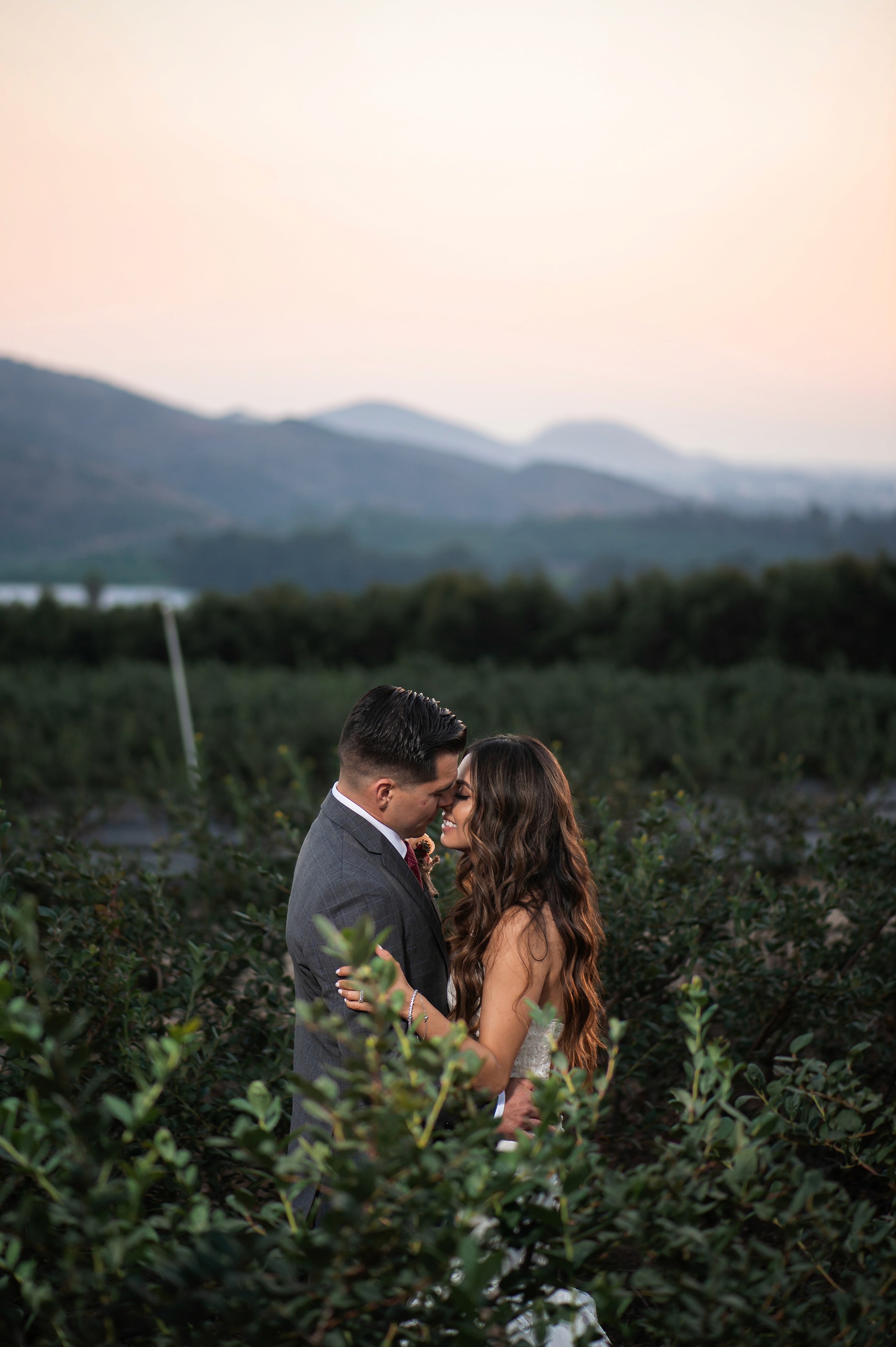 Bride and groom portraits with mountains in the background at Gerry Ranch