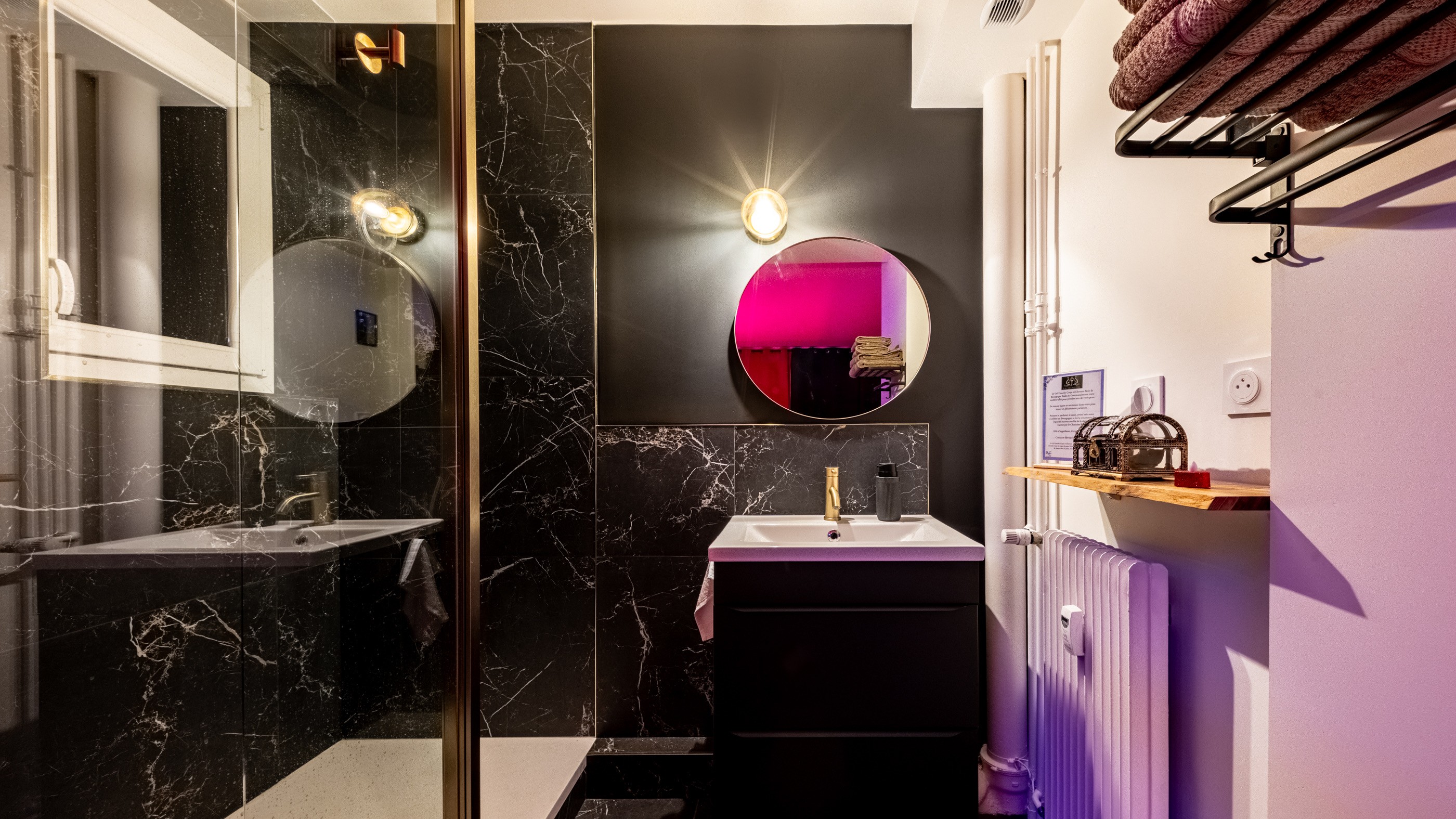 Sunset over calm ocean viewed through oval window.