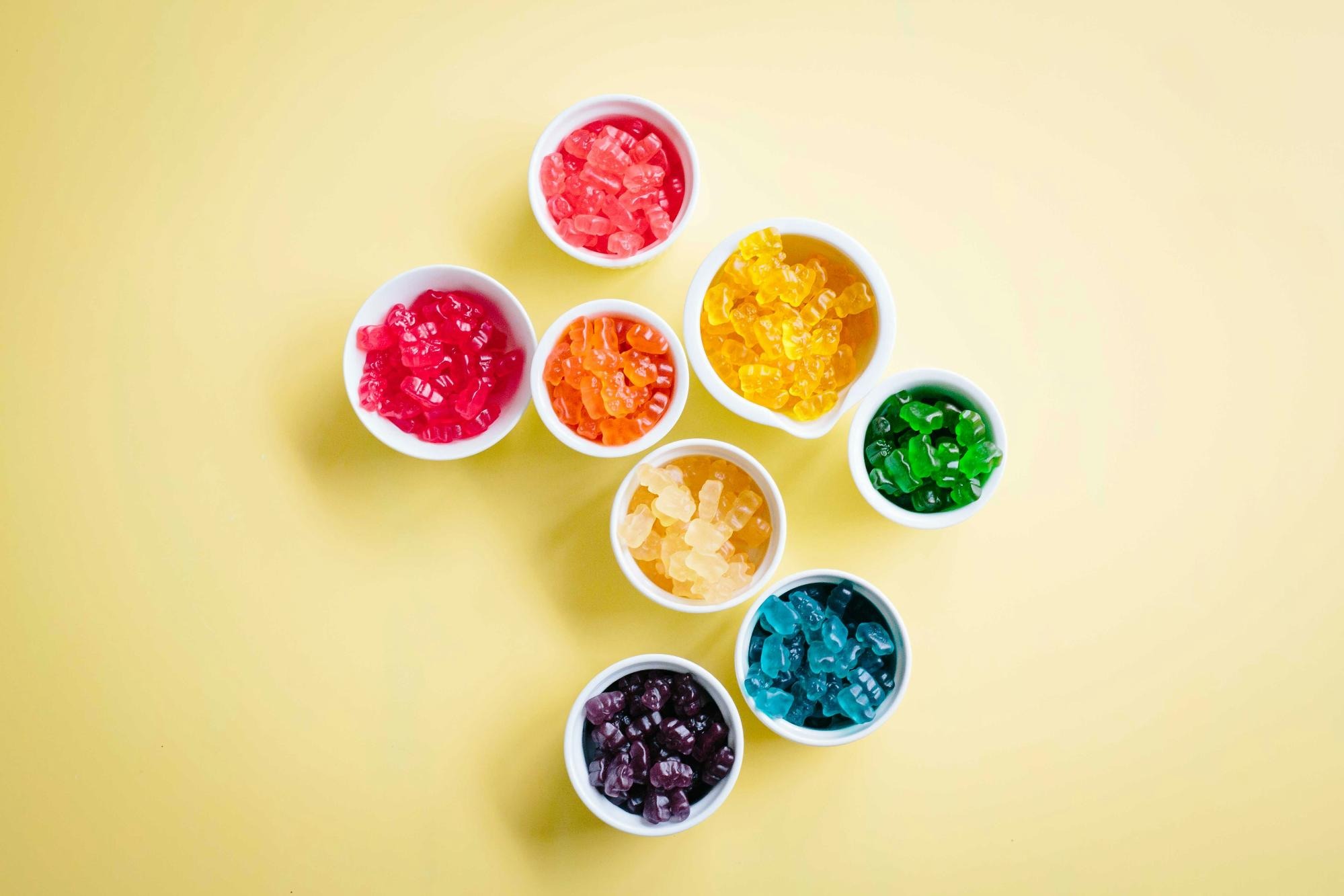 Assortment of innovative gummy vitamins featuring various colors, shapes, and added health ingredients