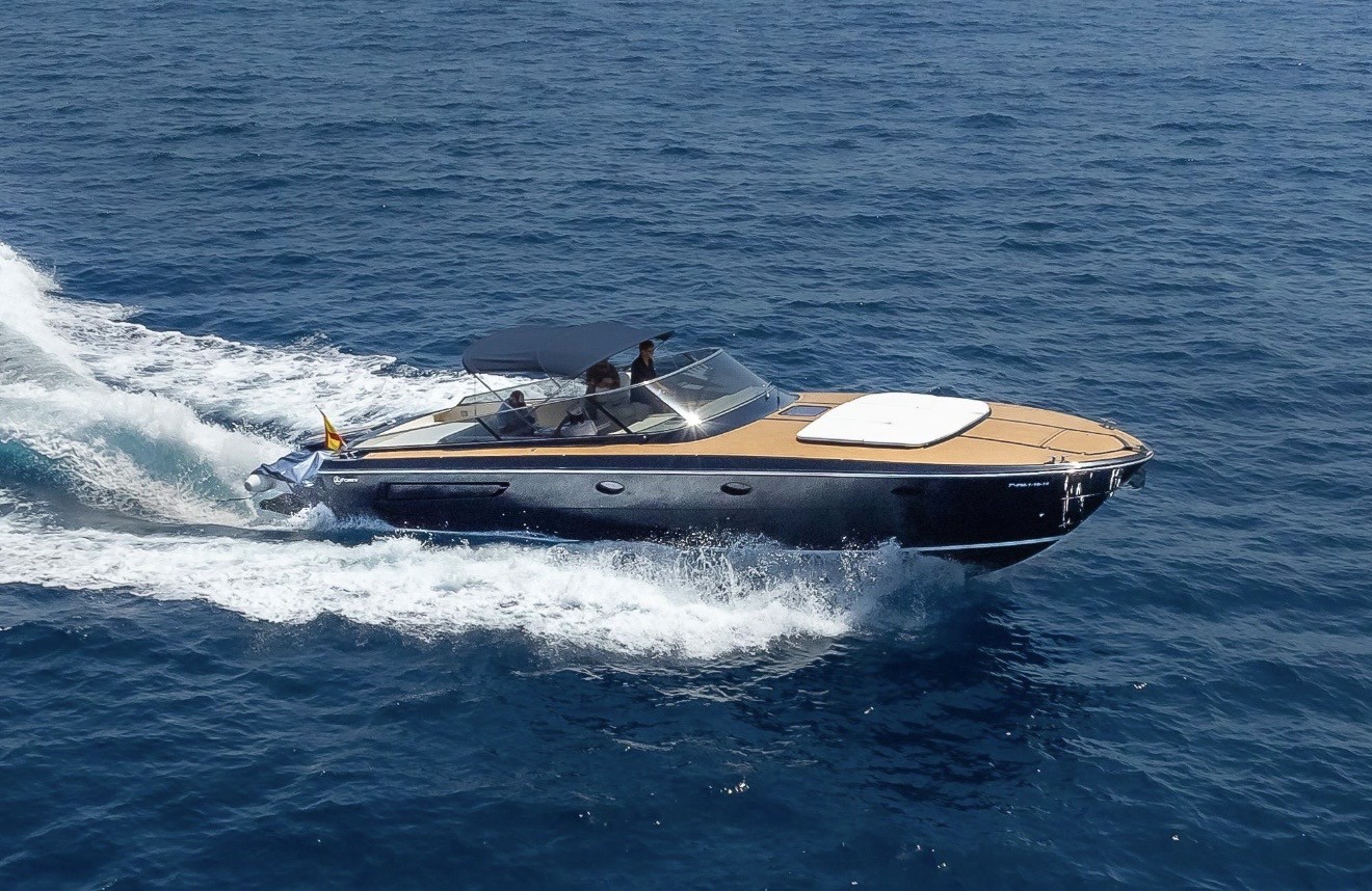 Motor yacht moving through deep blue water