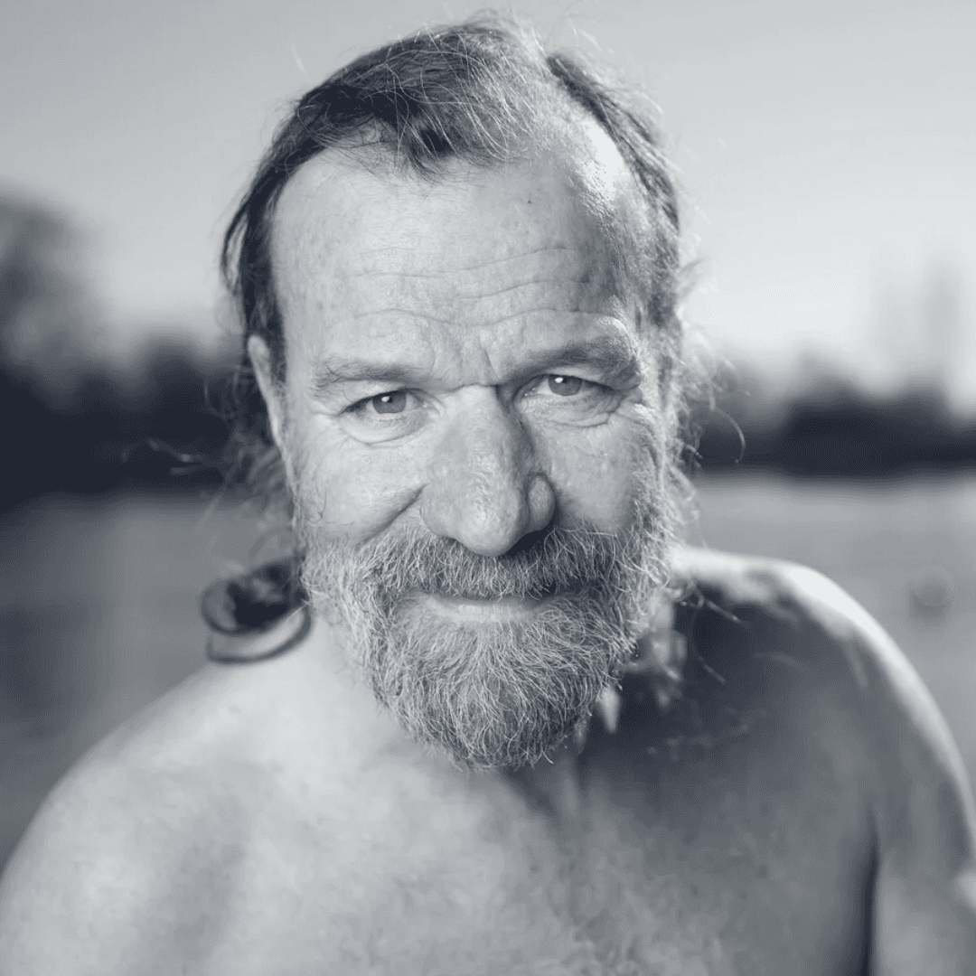 Portrait of a woman with straight long hair, in a dark t-shirt, set against a neutral backdrop.