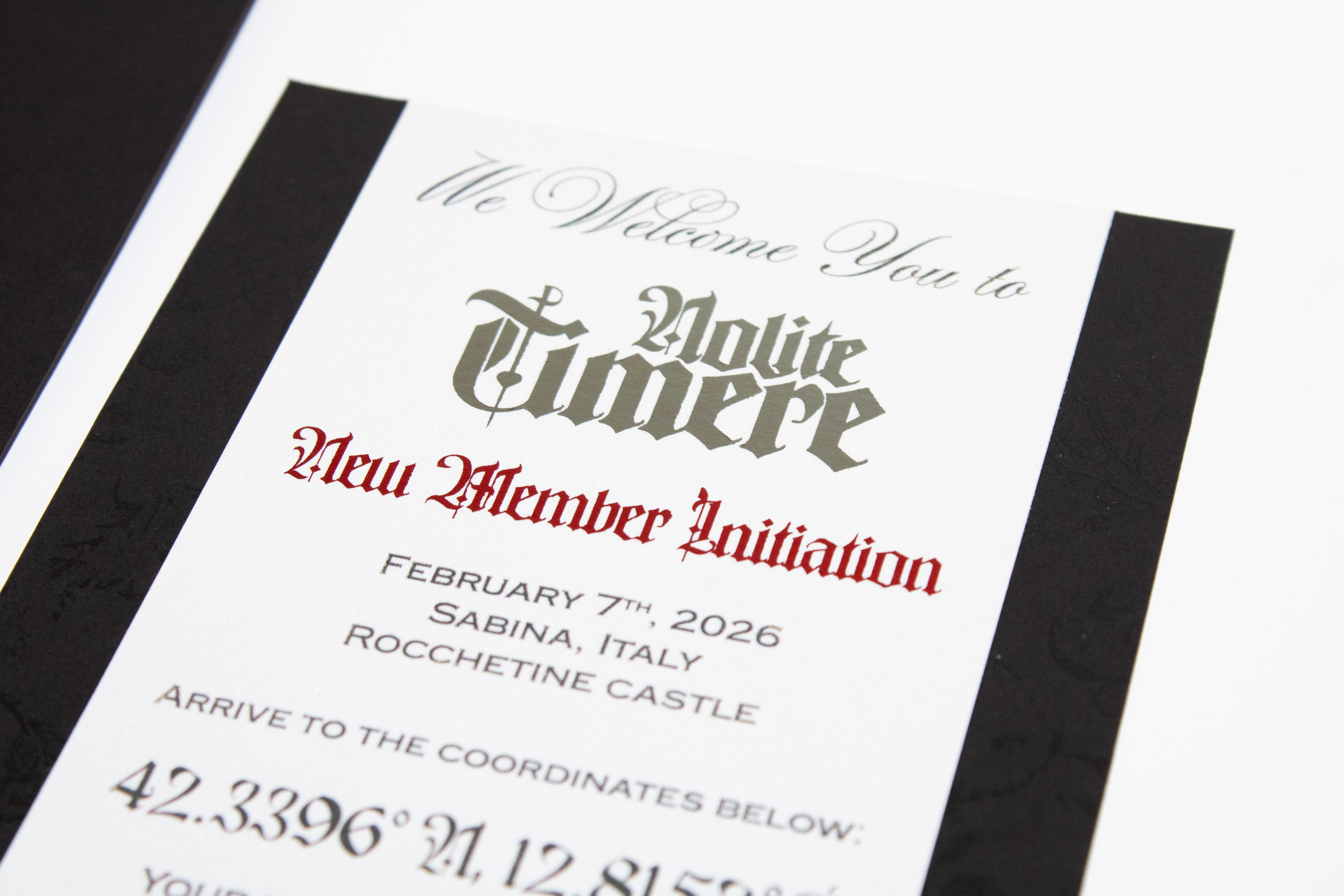 close-up shot of nolite timere invitation