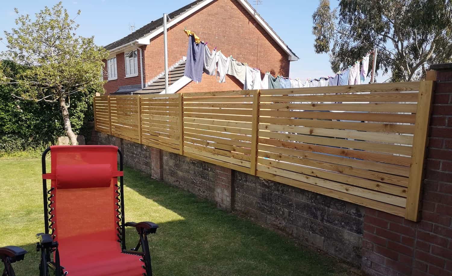 Horizontal slatted fence panels we fitted