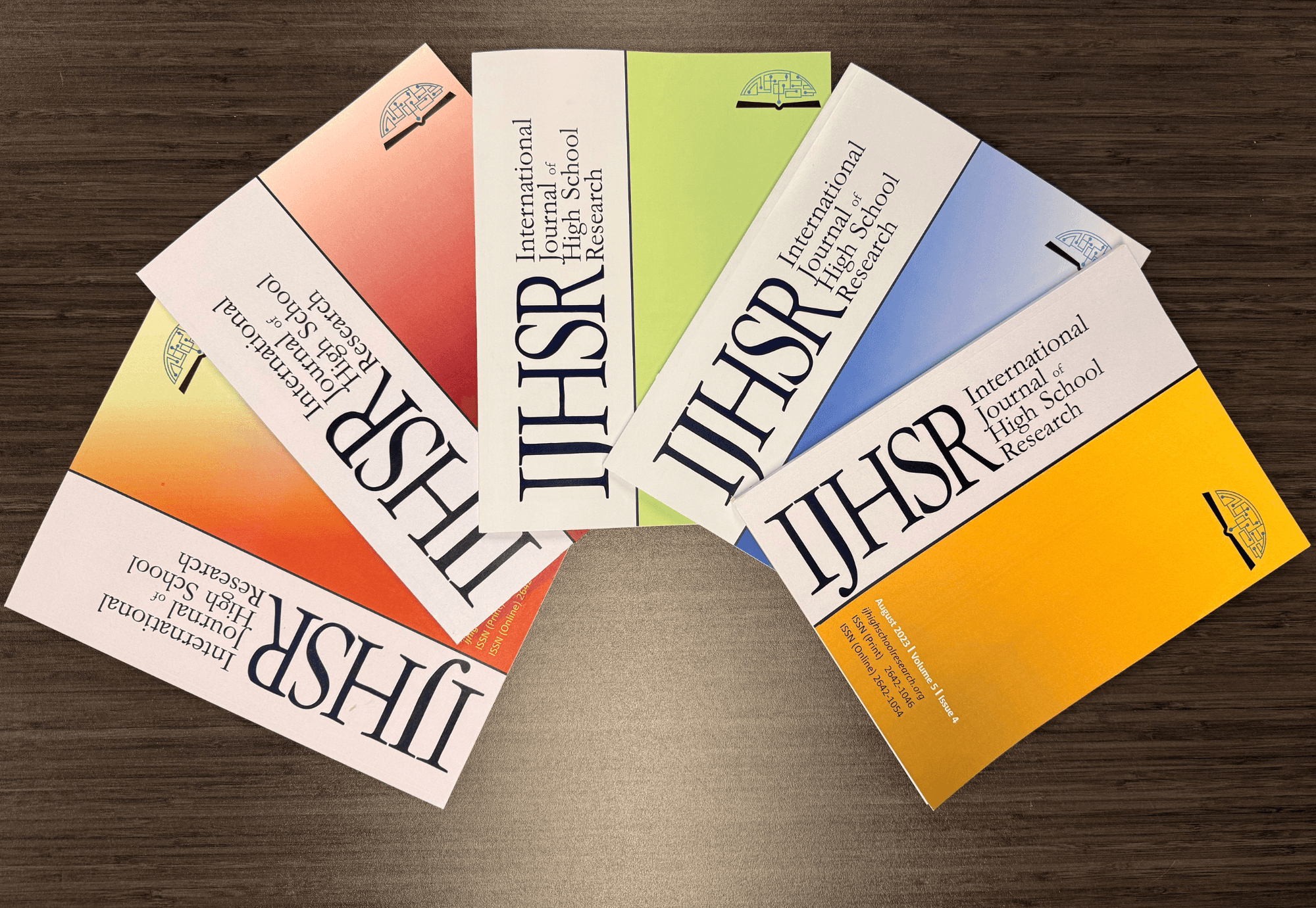 High school student comparing program-owned journals and independent academic journals for college application research publication