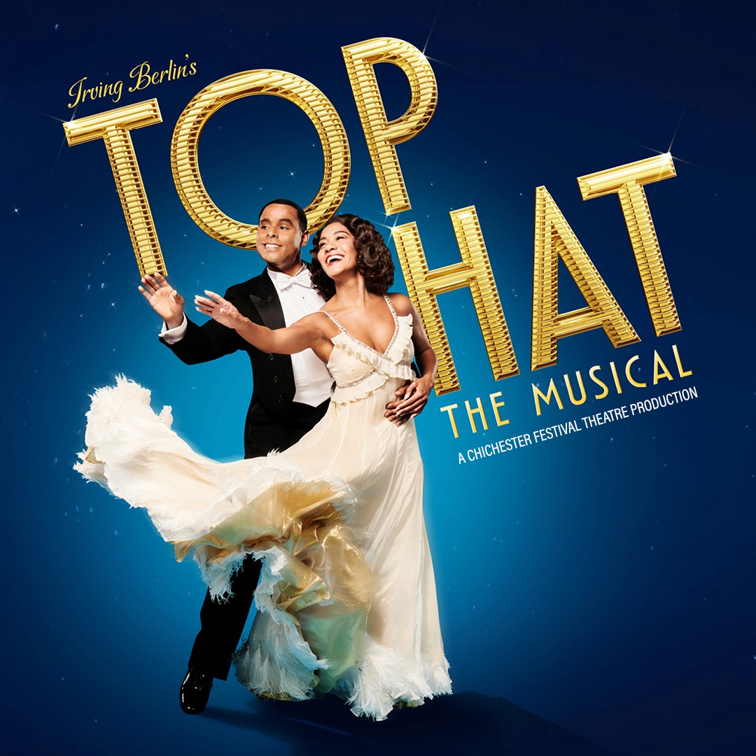 Dancers in formal attire performing for "Top Hat" musical.