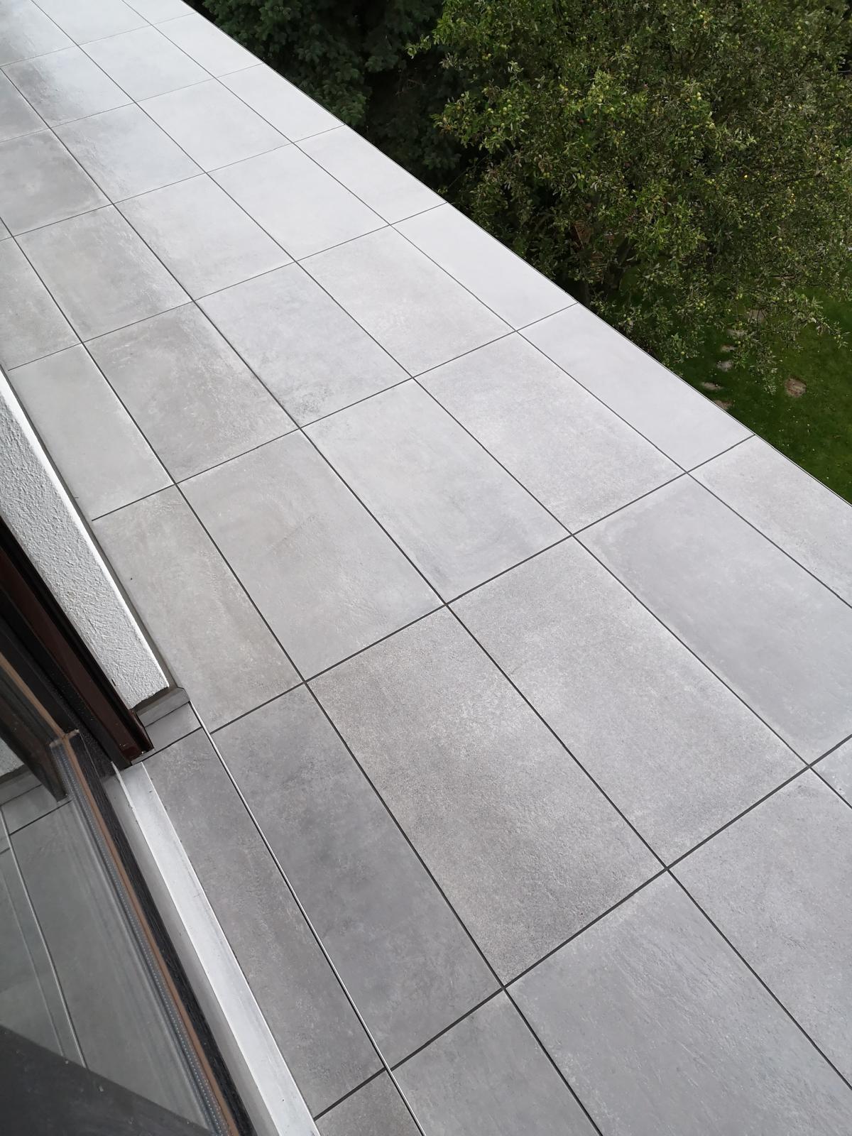 Exclusive high-rise residences with modern architecture, located in a quiet landscaped park with soft evening lighting