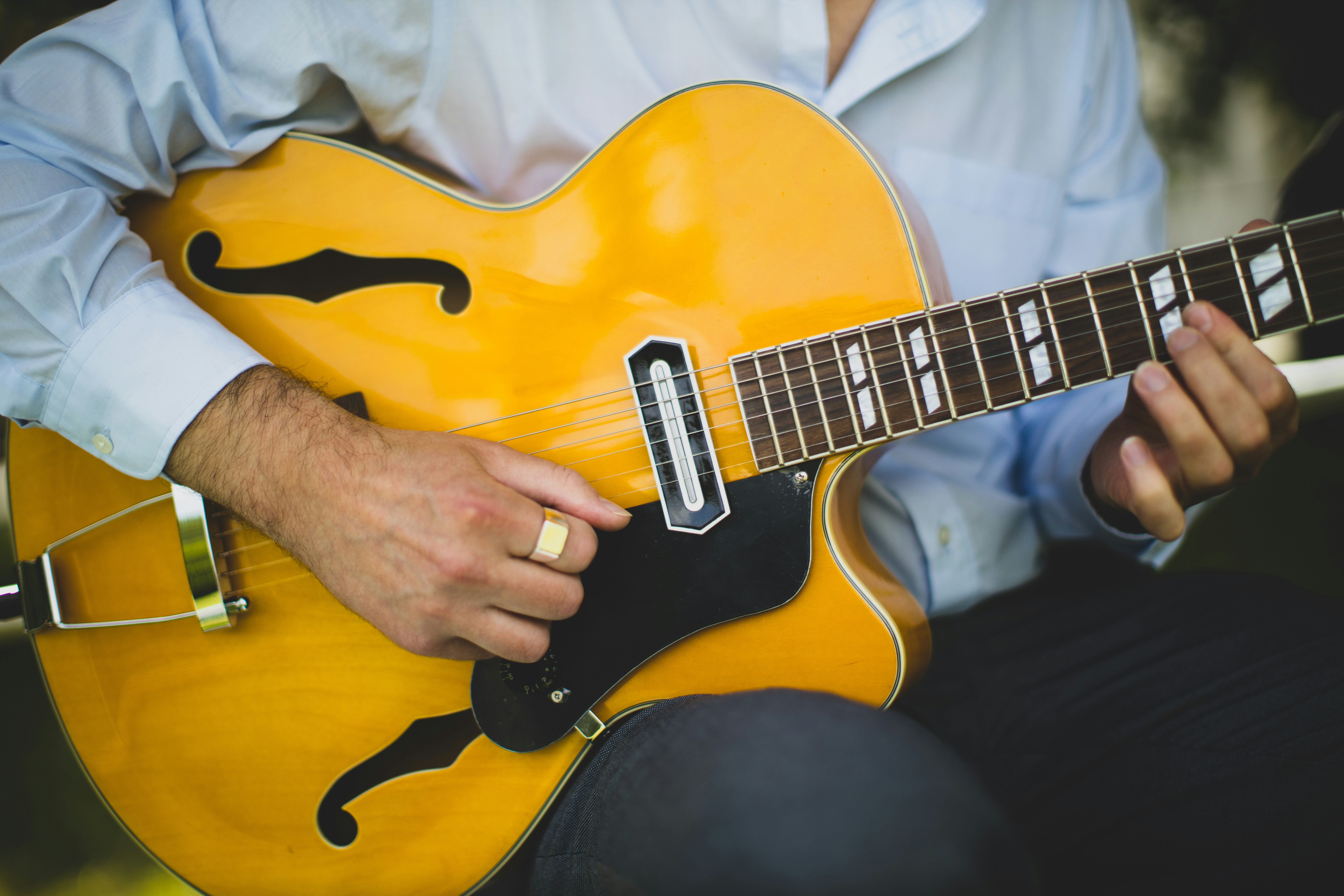 Man fretting a guitar