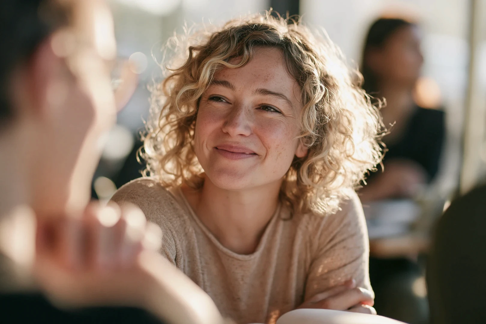 woman sitting at table with man smiling