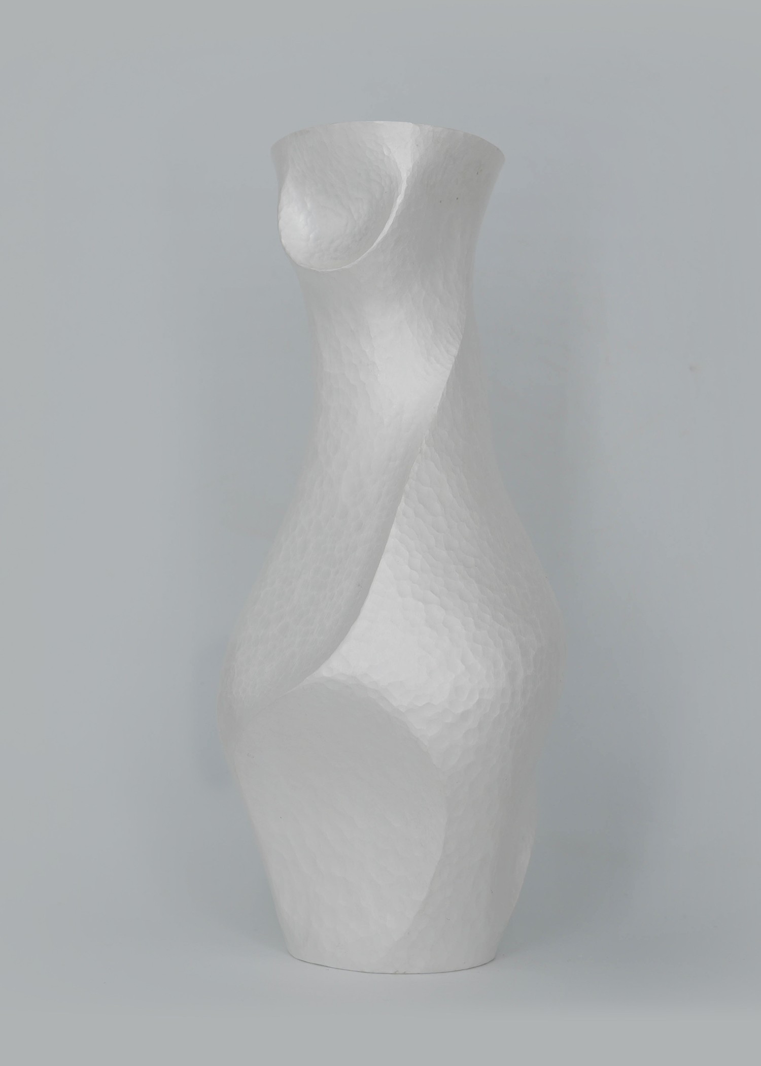 Constrict by Yuxin Song, hand-forged fine silver vase. Contemporary silversmithing and metalwork by artist Yuxin Song