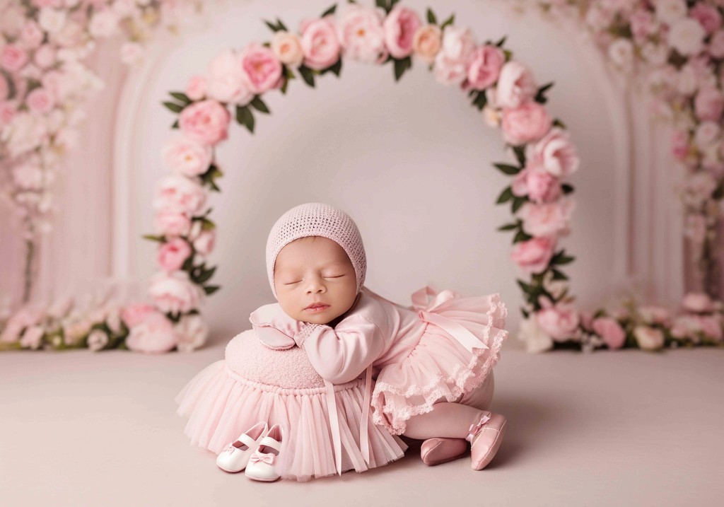 Expecting mom getting ready for maternity photoshoot — choosing dresses and preparing in Bloom N’ Baby Studio.