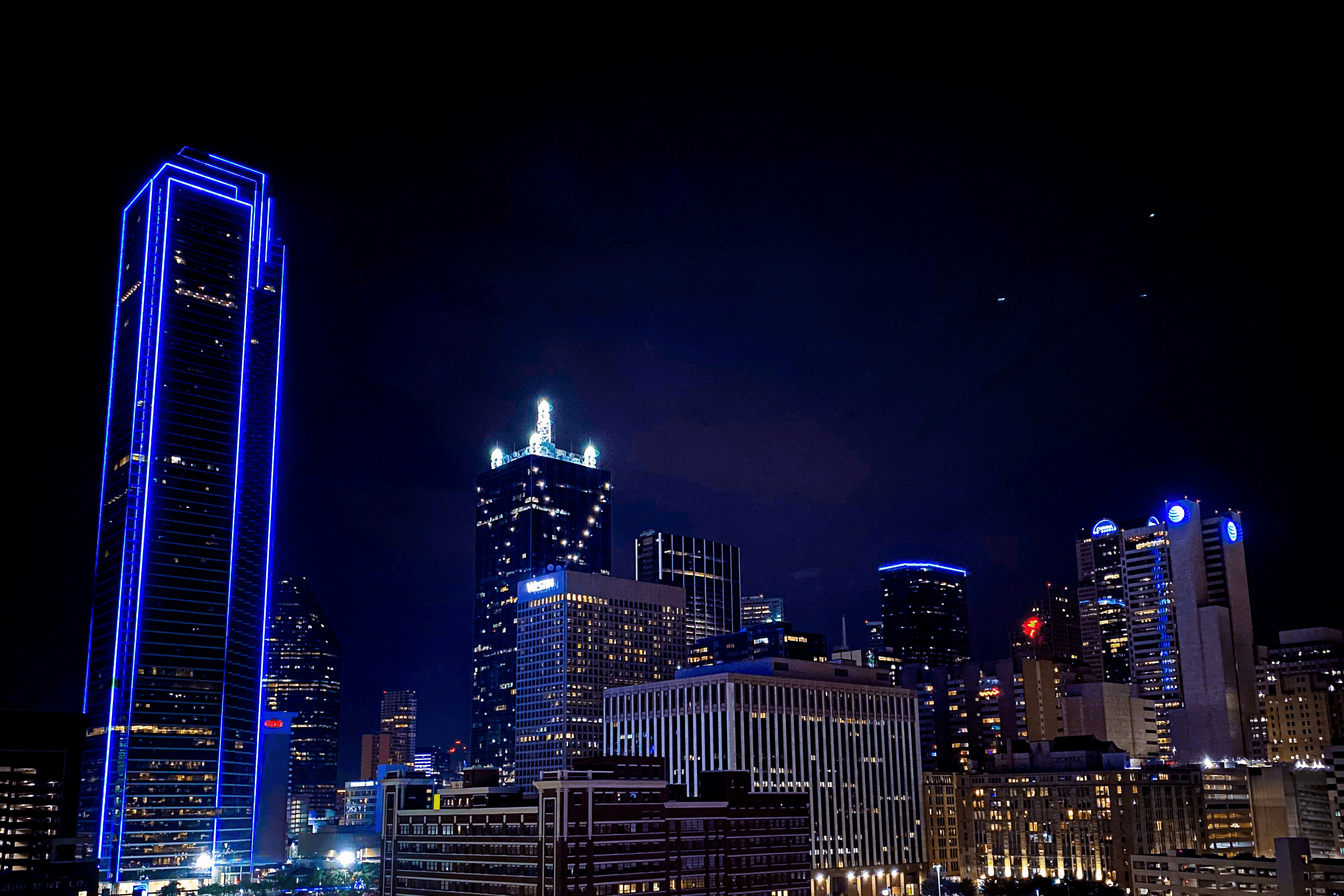 aerial photography of city with high-rise buildings during night time