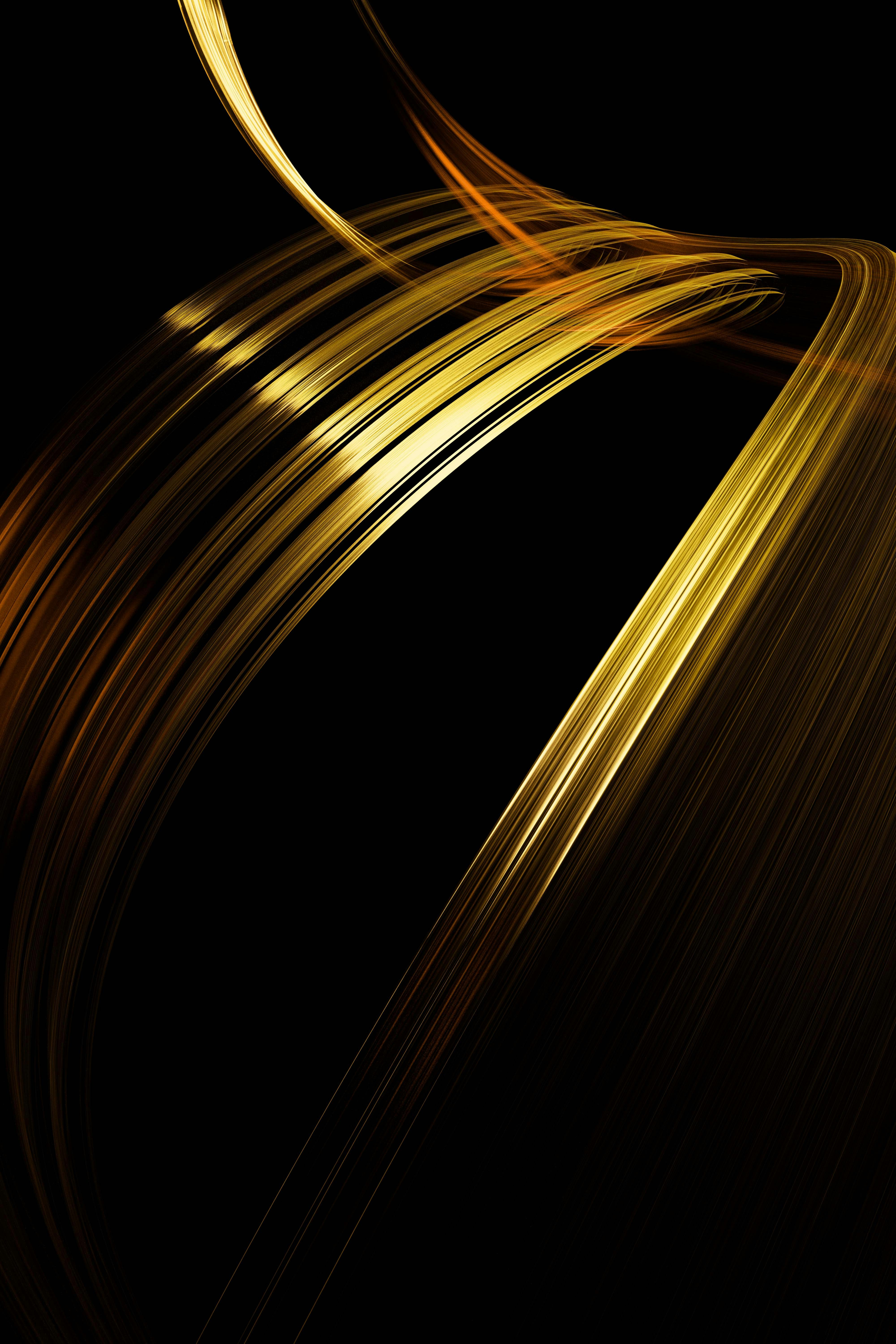 Golden light streaks against a black background.