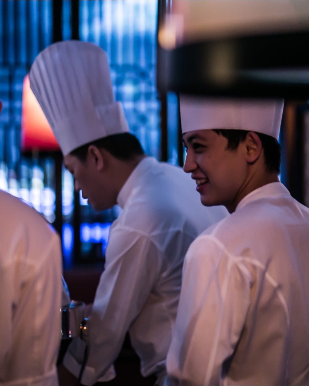 two people looking at a tablet and smiling