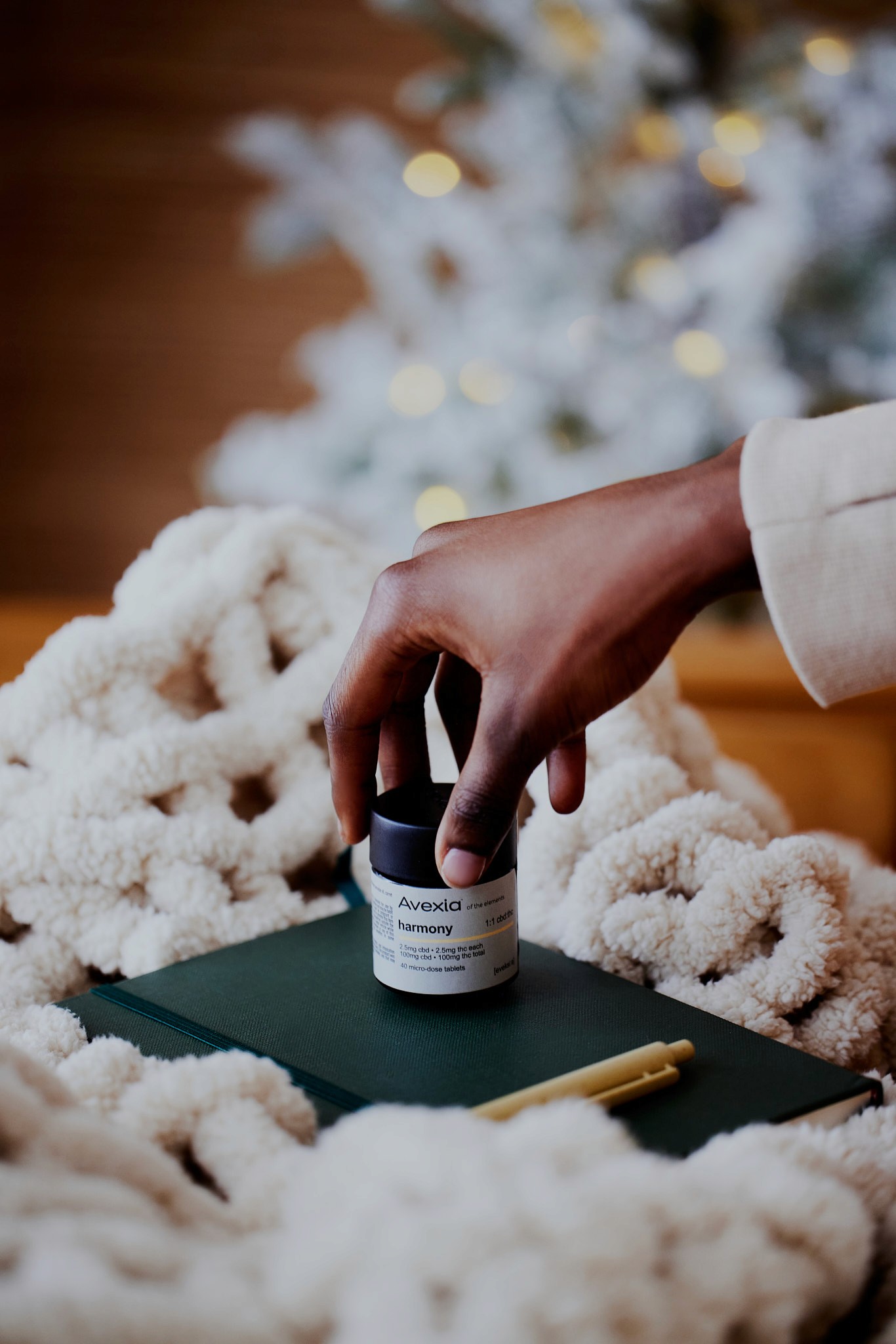 Young woman with dark hair and bangs, wearing red.