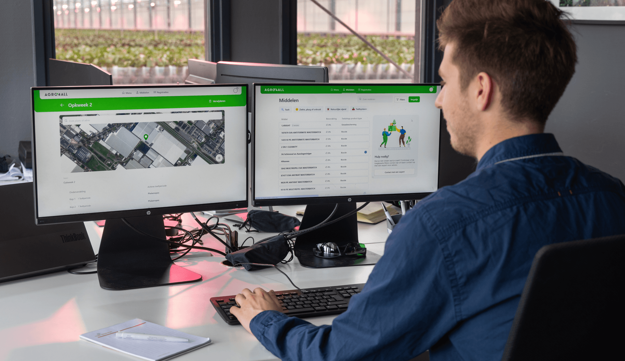 Person using the Agro4All portal at their desk inside the greenhouse