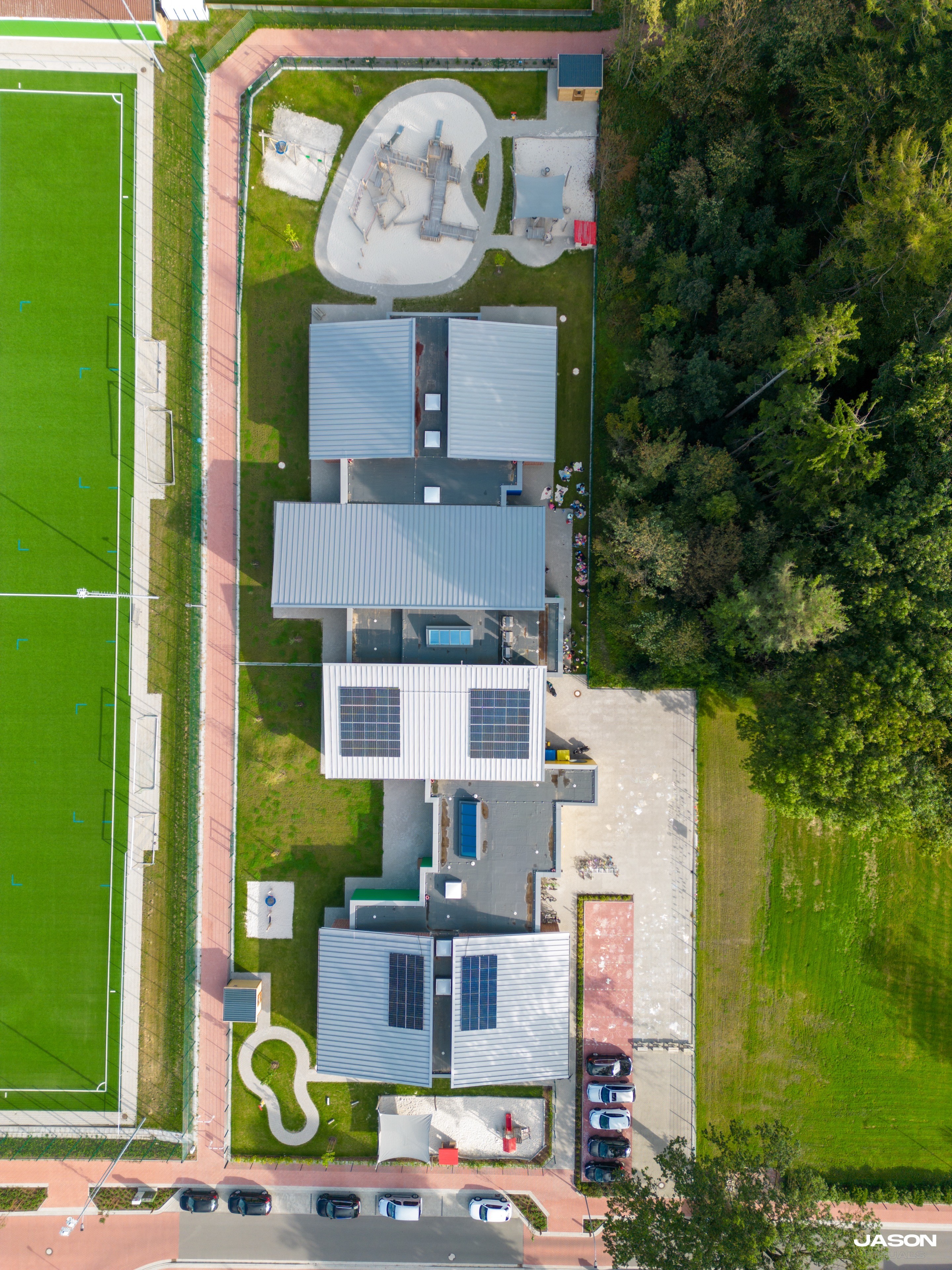 Snow covered trees on a frozen lake at sunrise