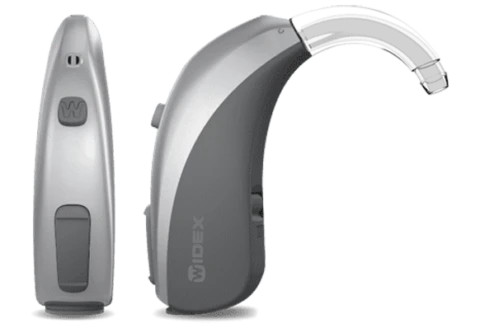 Two gray, sleek electronic devices displayed side by side on a dark background. Modern Hearing Aid
