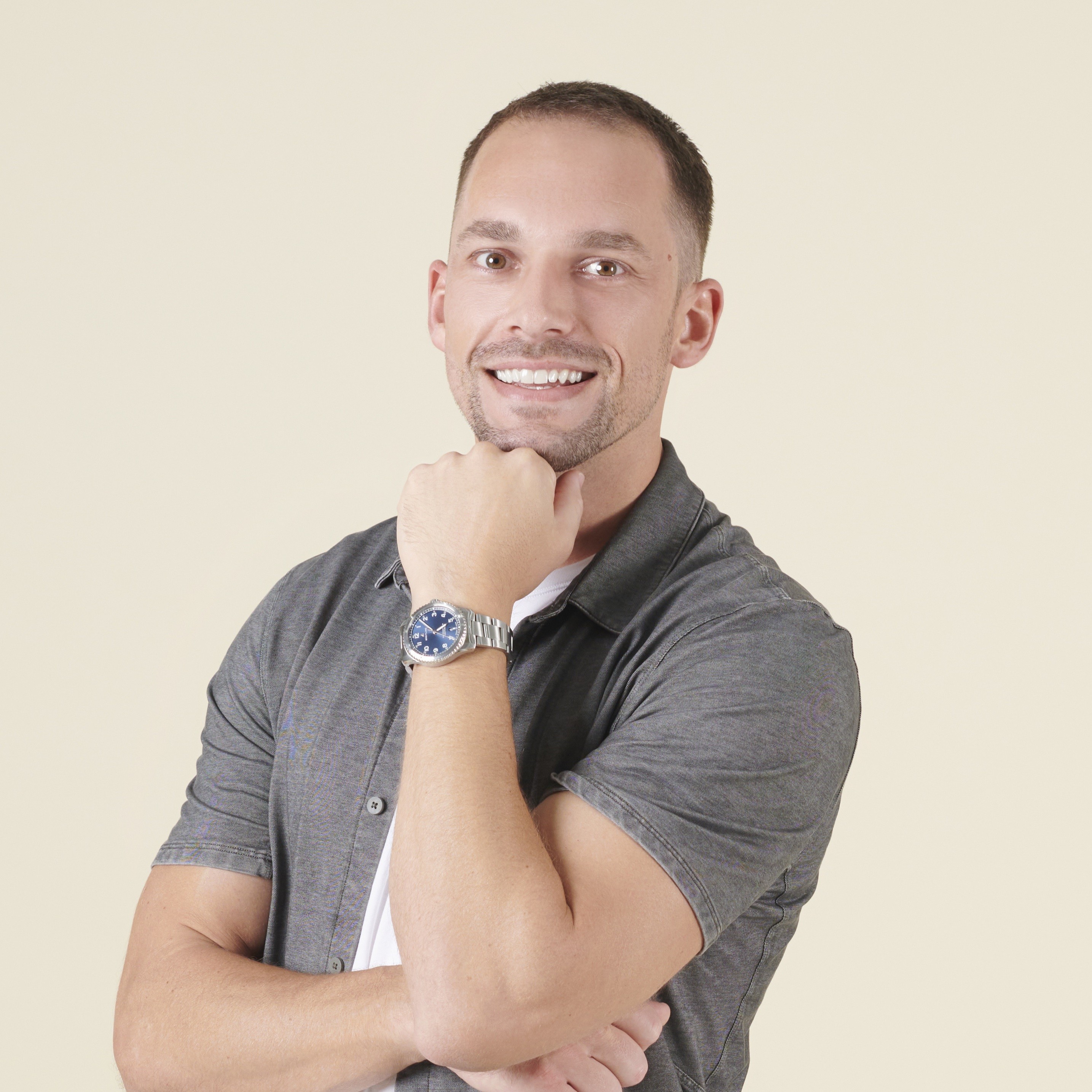 Portrait of founder smiling with yellow background