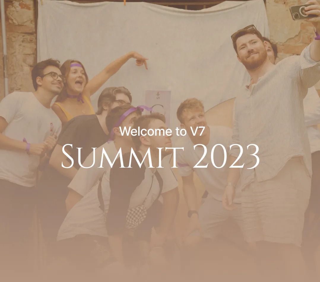 "Welcome to V7 SUMMIT 2023" written over a picture of a lively team from the site