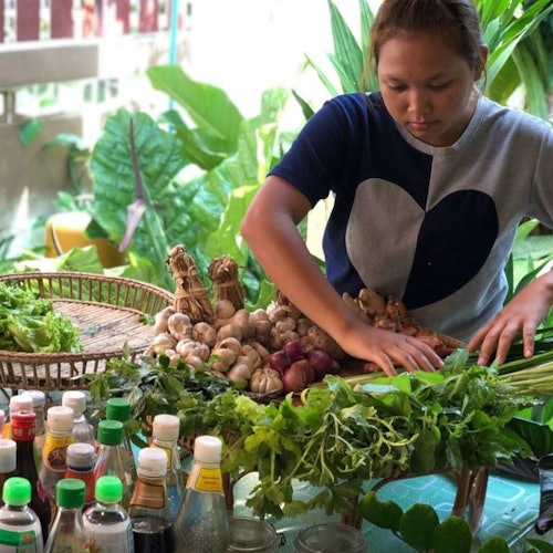 Discover vibrant Thai herbs, vegetables, and spices along the way.