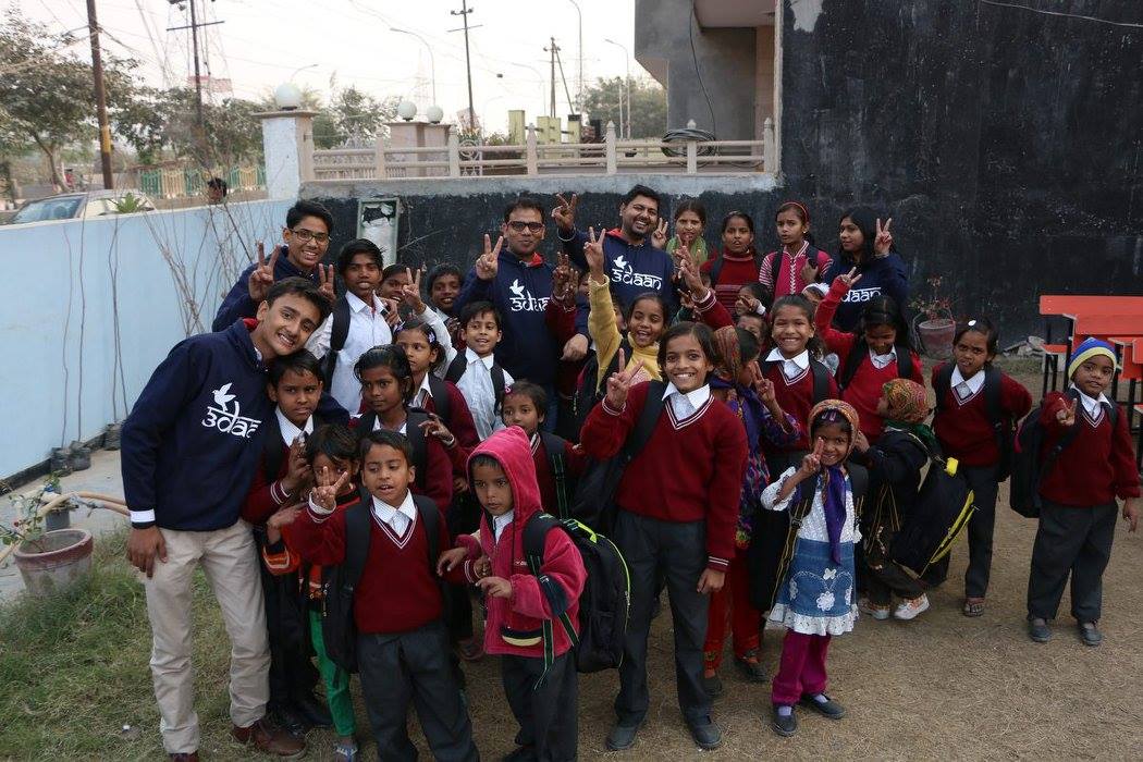 man in black crew neck t-shirt and blue shorts holding woman in white and red