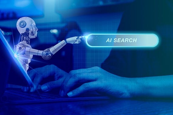 Google image showing a small robot pressing a glowing “AI SEARCH” button as a person types on a laptop.