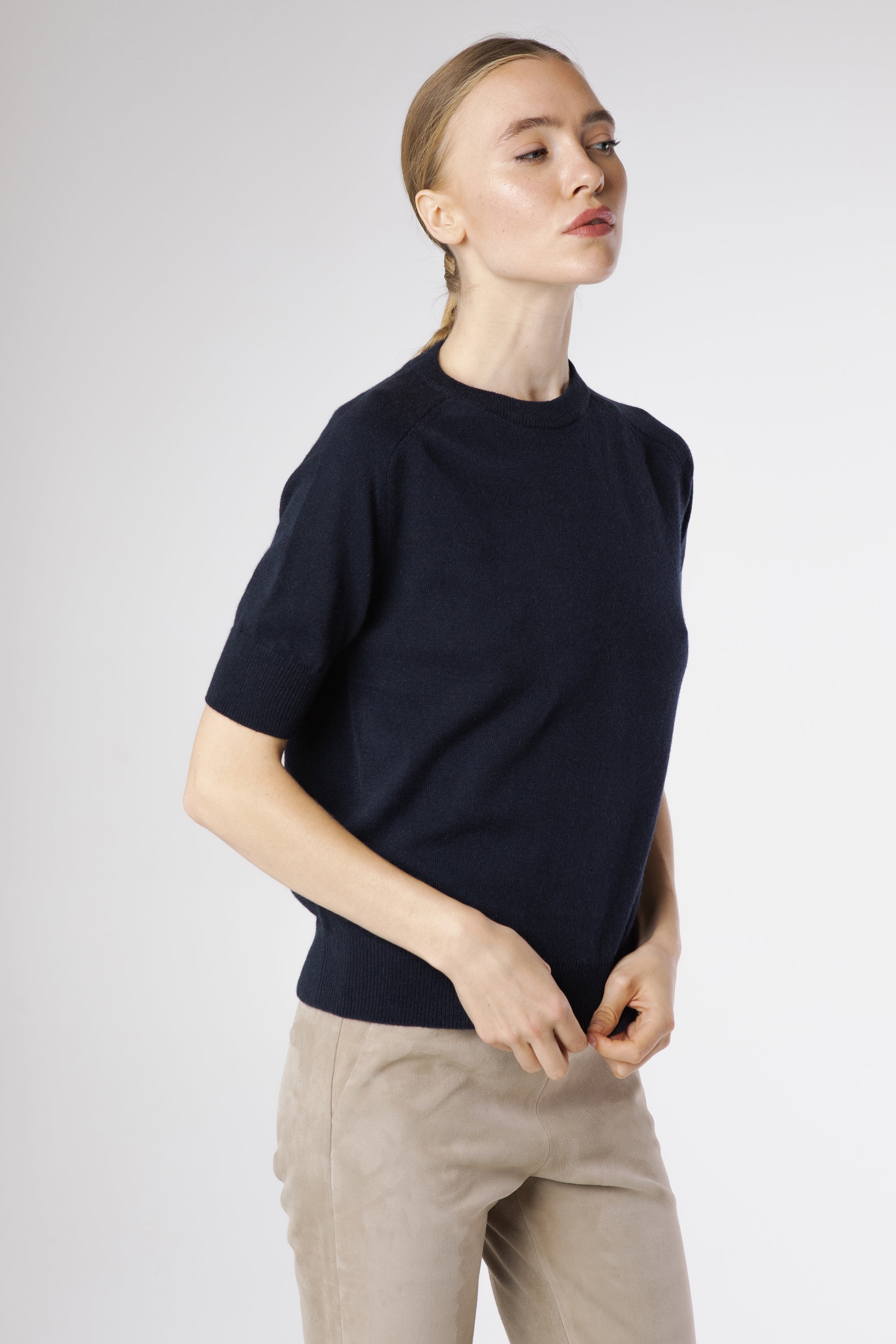 Side profile of the Magda Cashmere Pullover Beluga revealing its flattering fit and elegant lightweight drape.