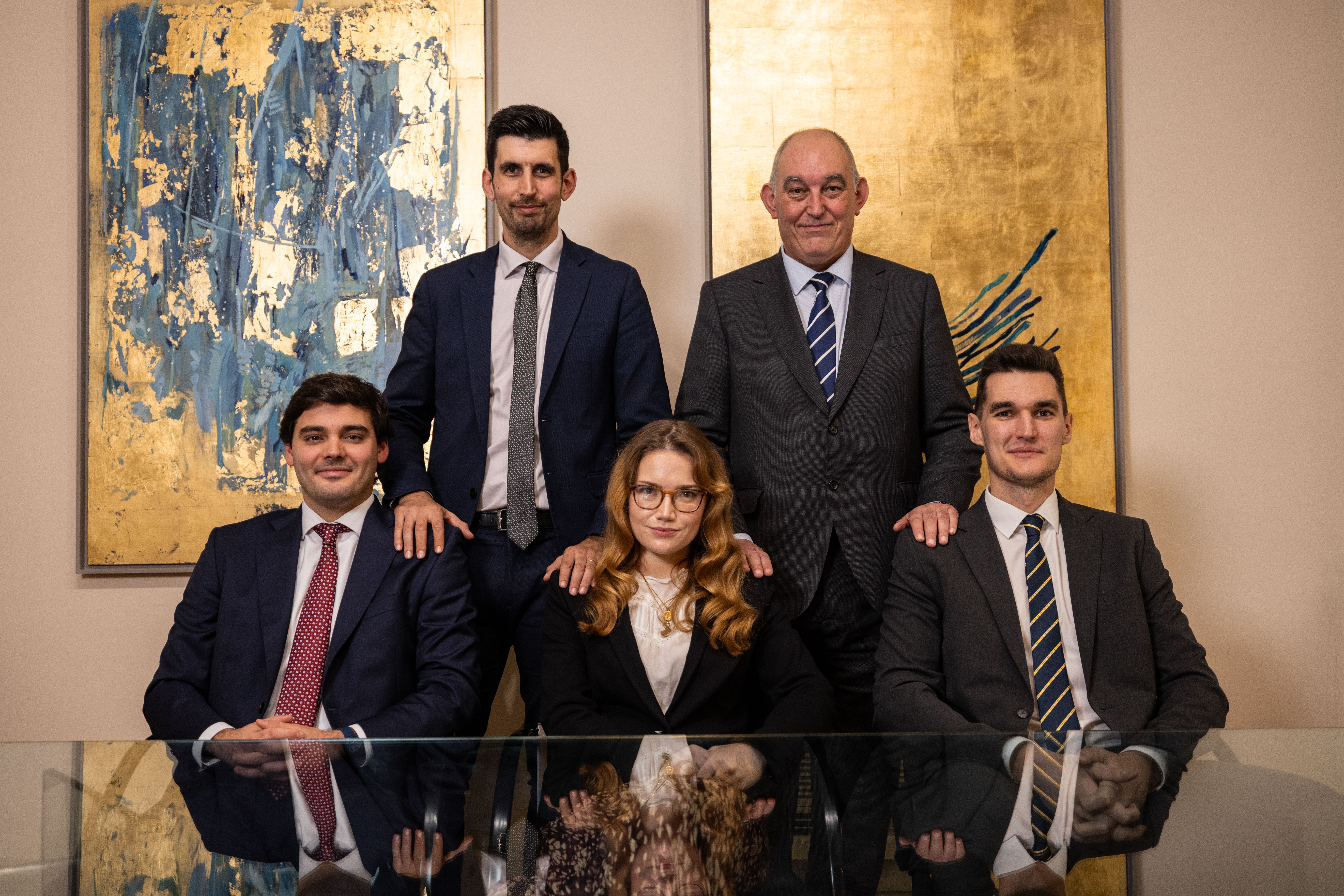 kids lying on a glass land and smiling