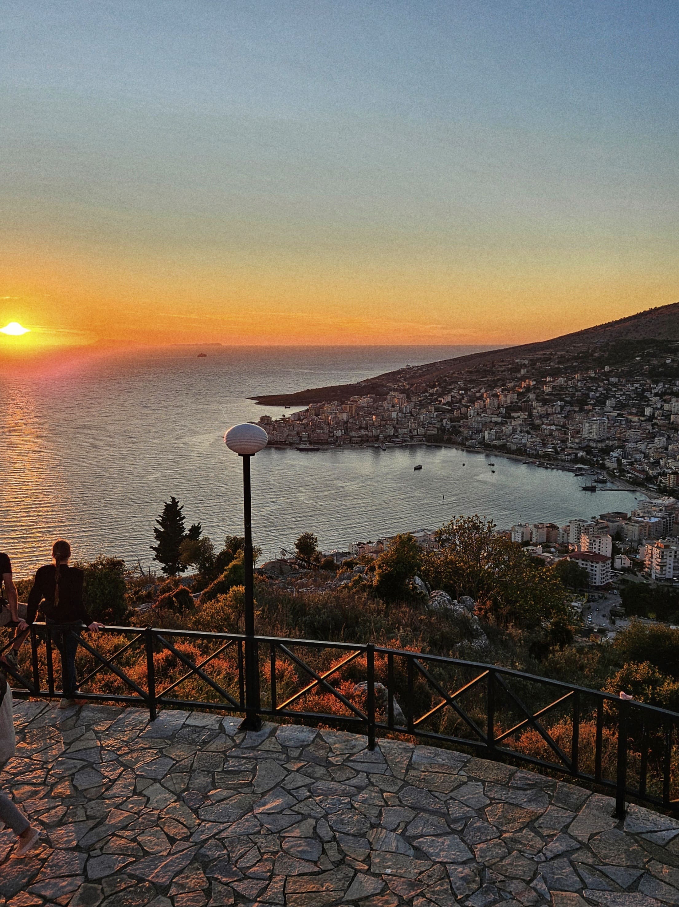 a person holding a small bowl of food