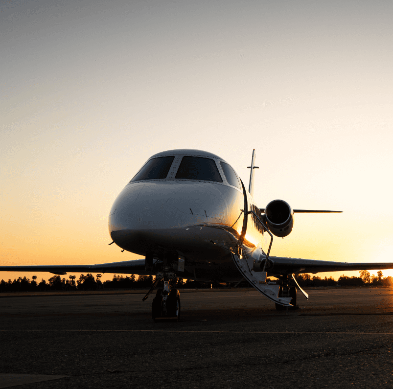 Private jet at sunset, symbolizing luxury travel and exceptional chauffeur services by States Car Service.