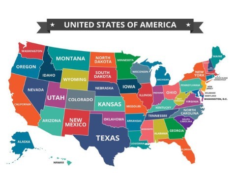 two people looking at a tablet and smiling