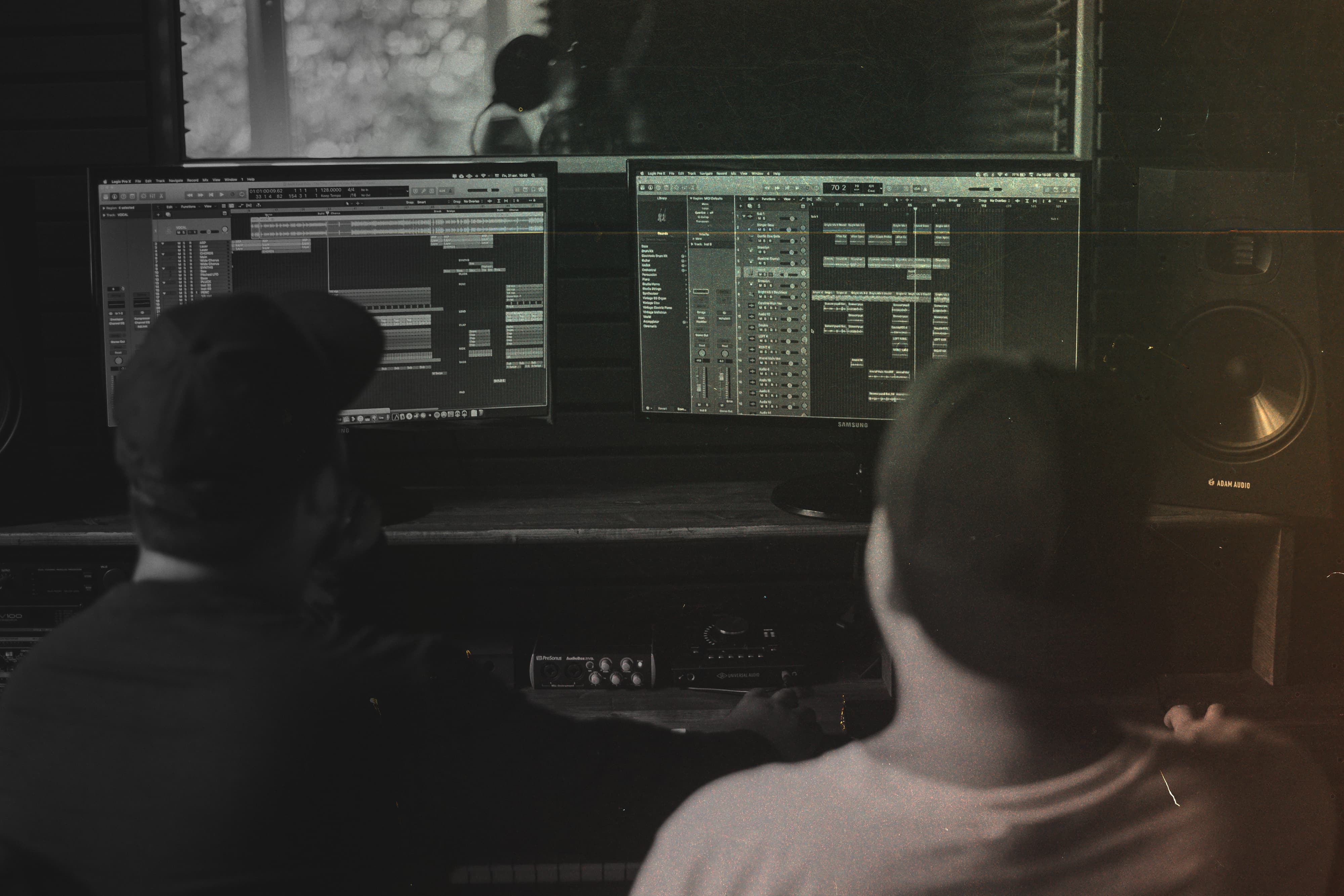 Two artists creating in a recording studio