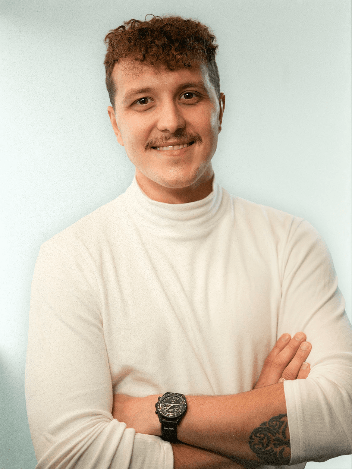 man standing beside wall