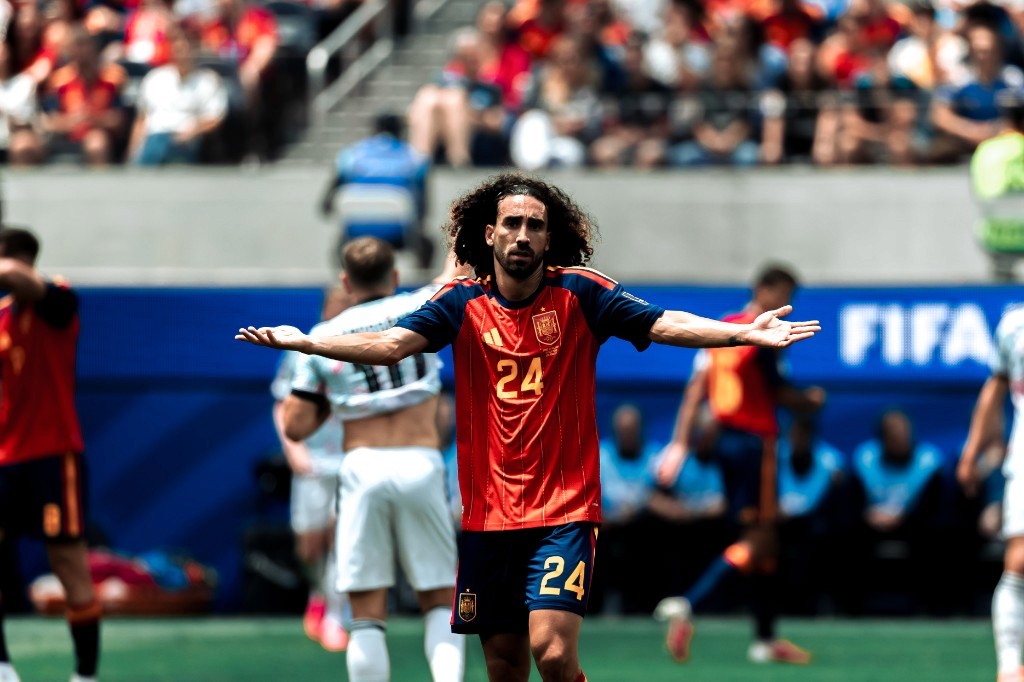 Spain's Marc Cucurella questions a call with arms outstretched during Spain vs Belgium at the 2026 World Cup