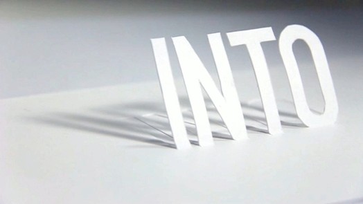 into word made of paper cut-outs