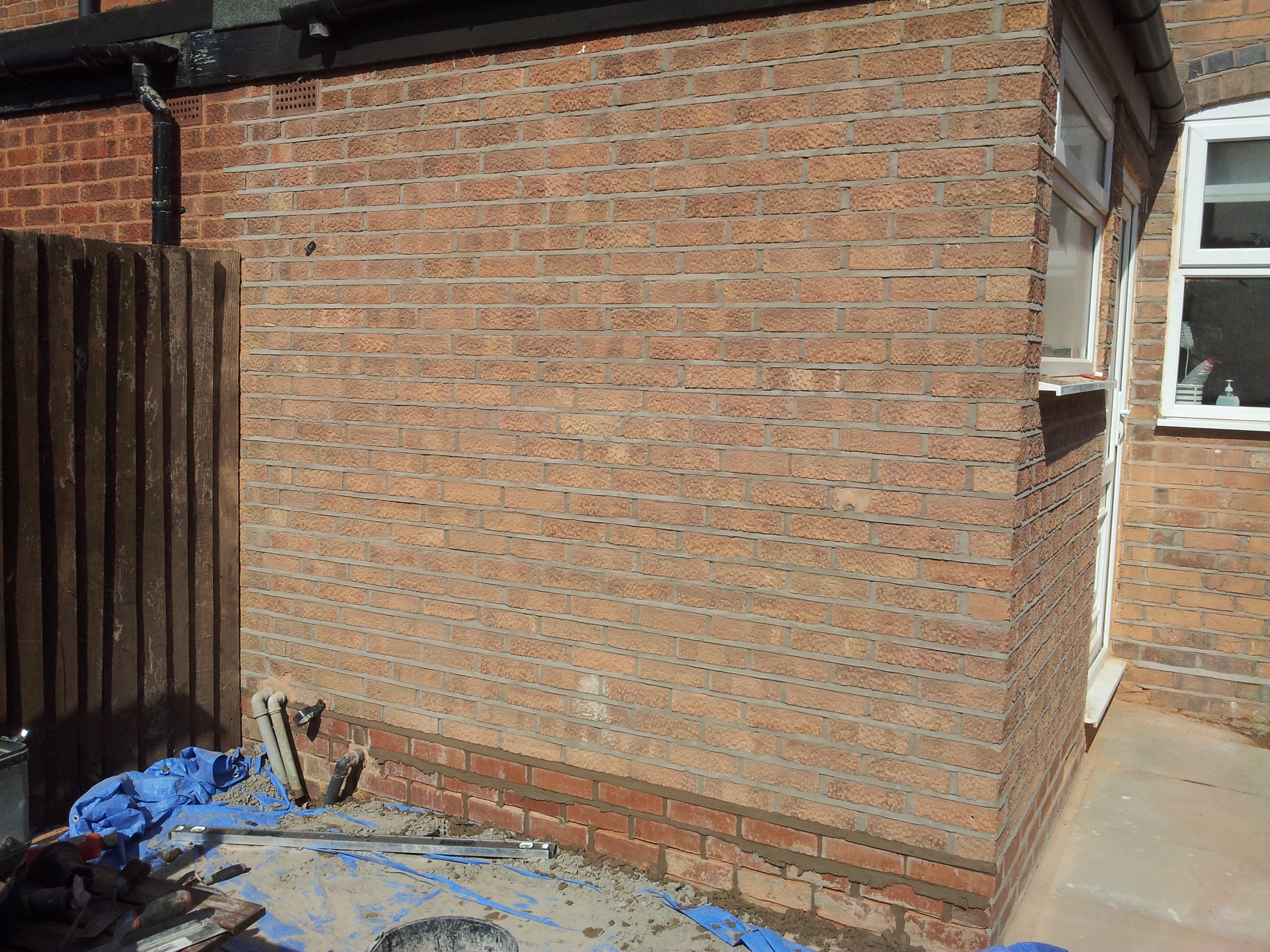 Newly pointed brick wall