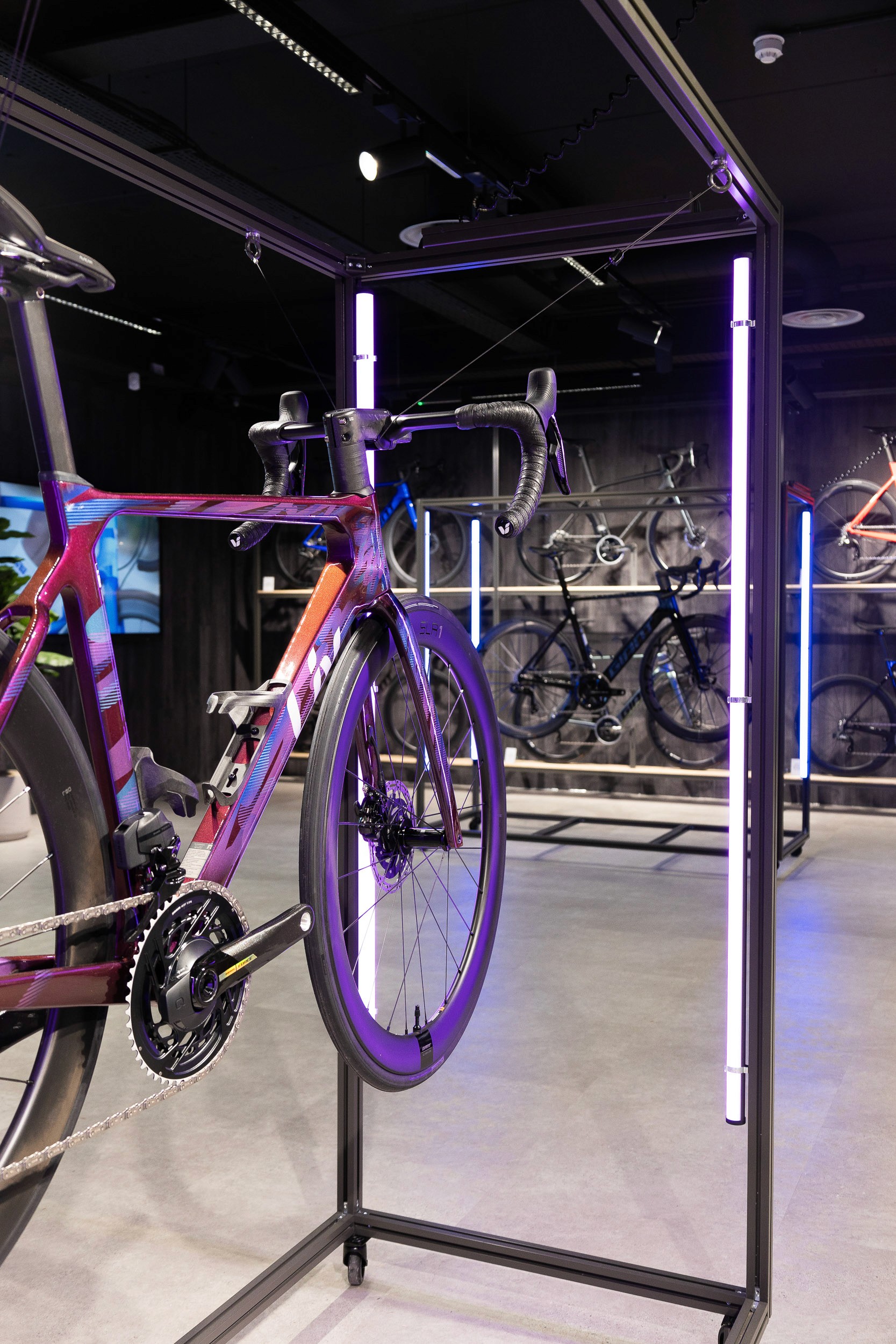 Premium Giant bicycle displayed on a bespoke feature plinth within the showroom
