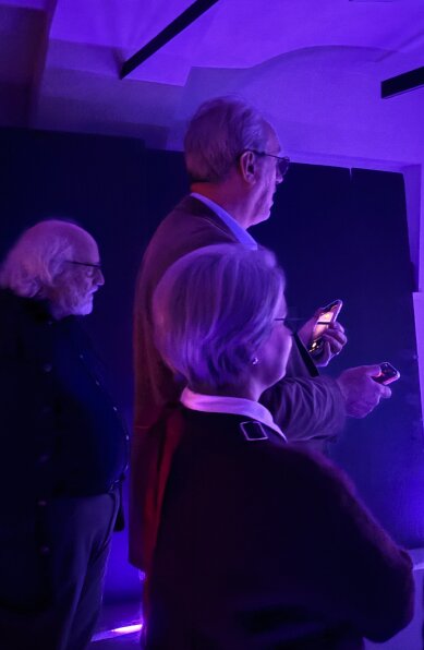 Visitors interact with the projection in The Byte Room.